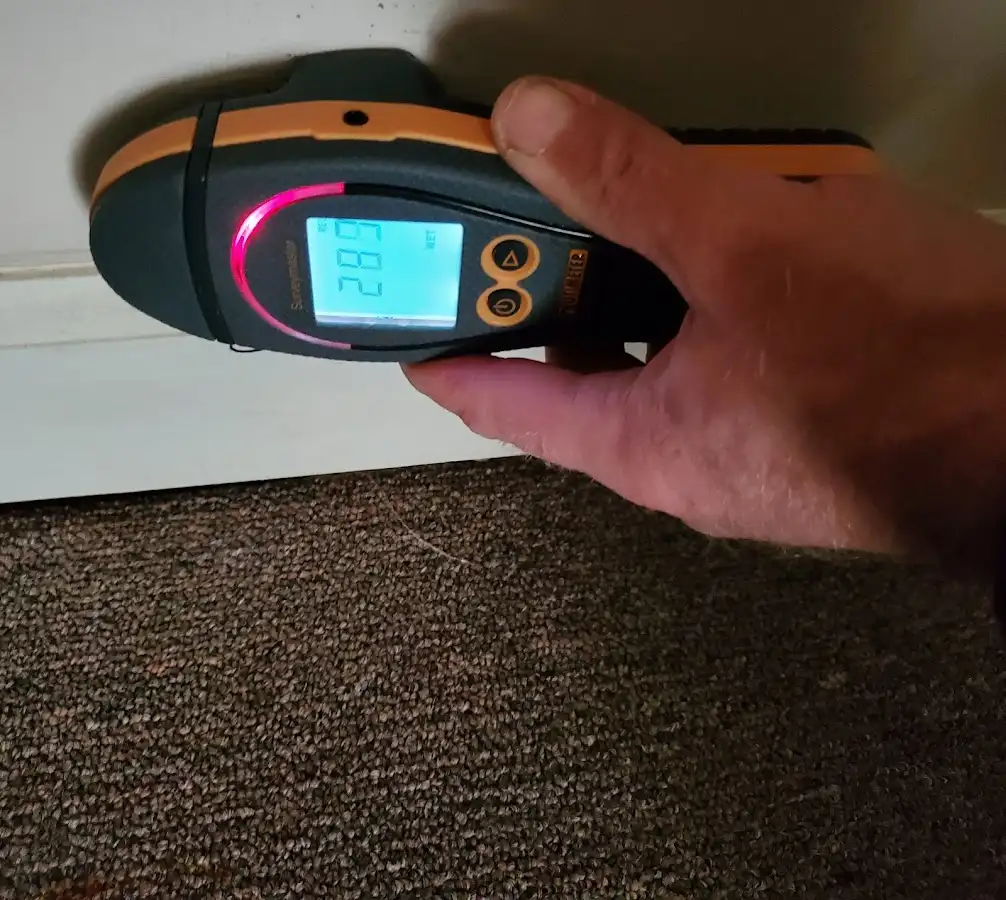 Moisture detection at baseboard during Storm Damage Restoration in South Patrick Shores